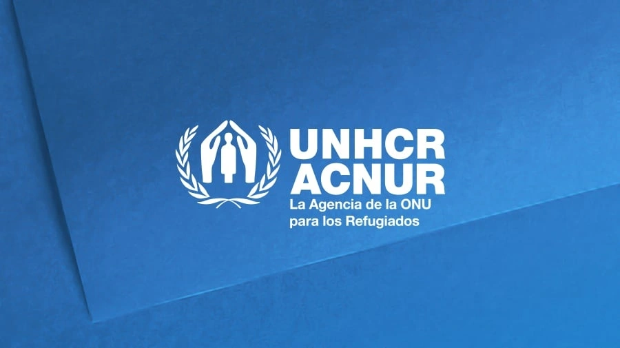 UNHCR ACNUR logo in white on a blue background with the Spanish tagline La Agencia de la ONU para los Refugiados.